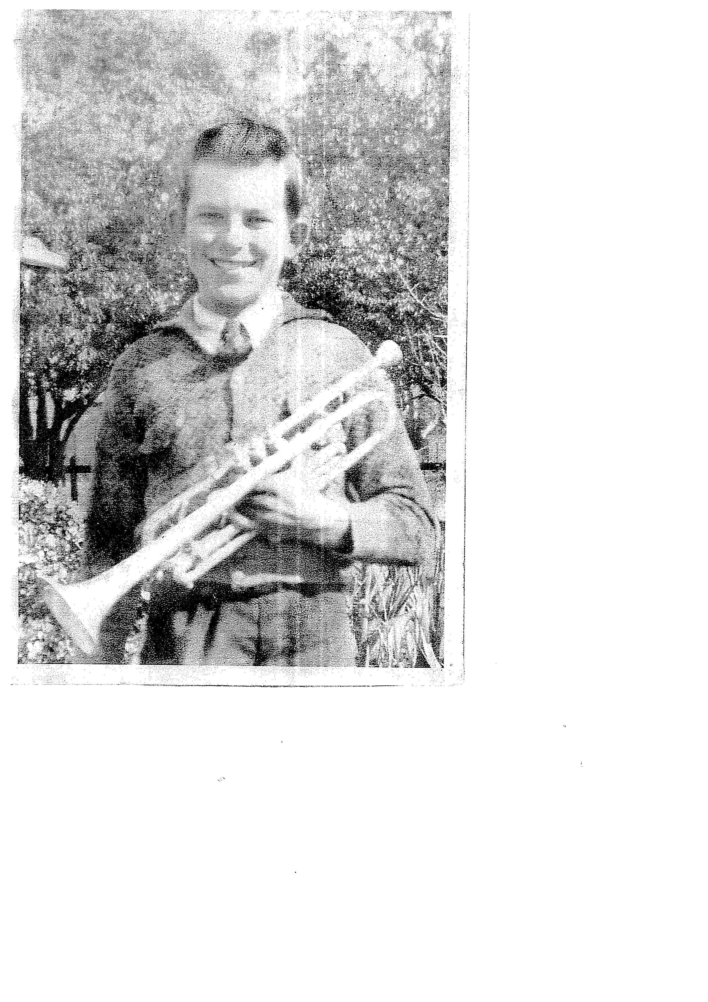 Old photo of Fred Beauglehole holding a trumpet